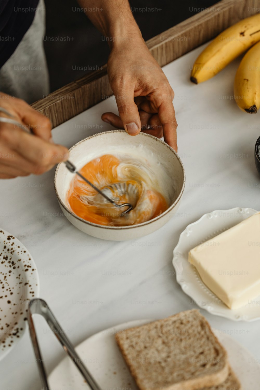 a person is mixing something in a bowl