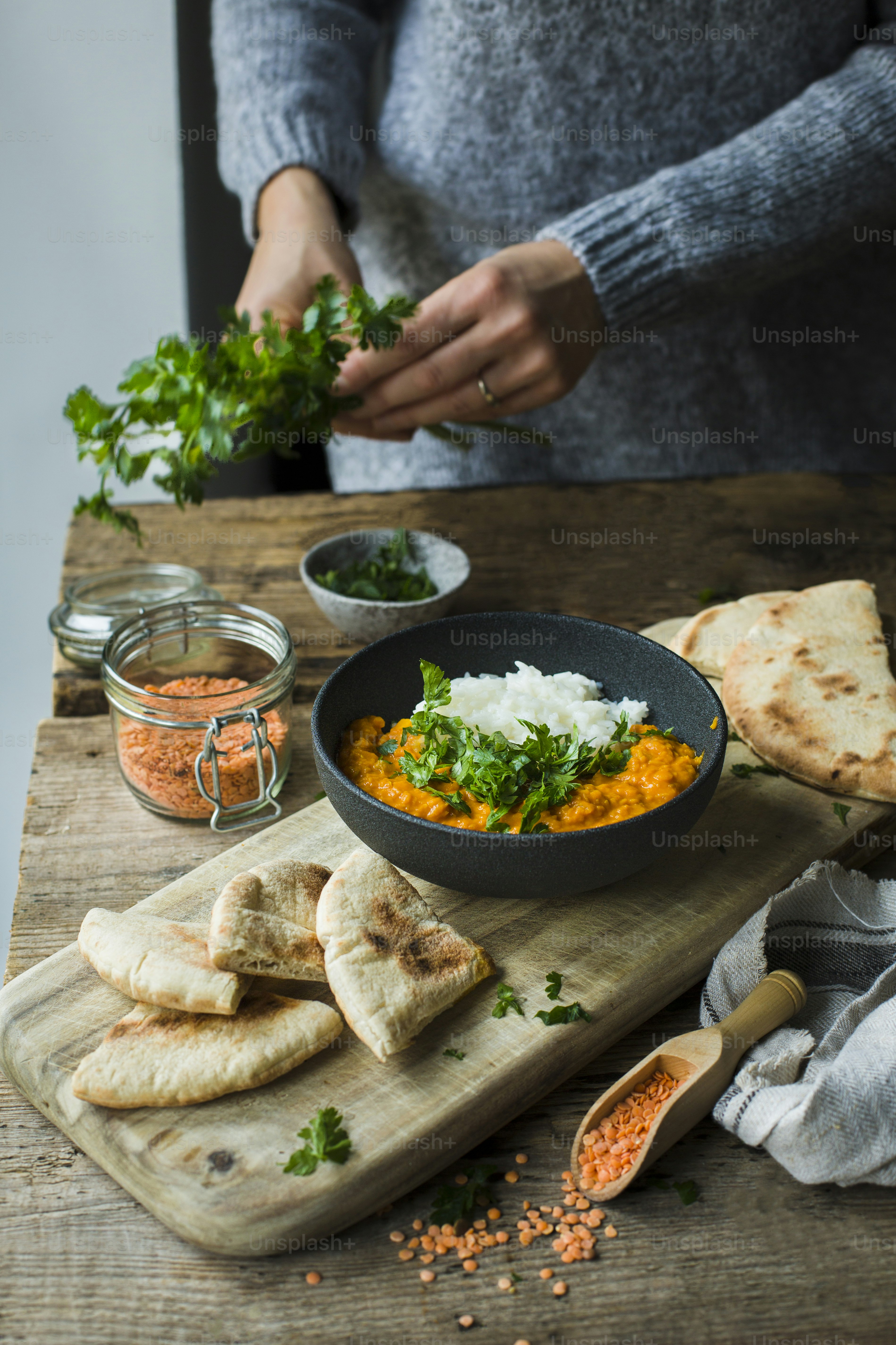 a person preparing food on a cutting board