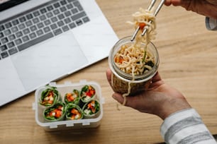 a person holding a spoon with some food in it