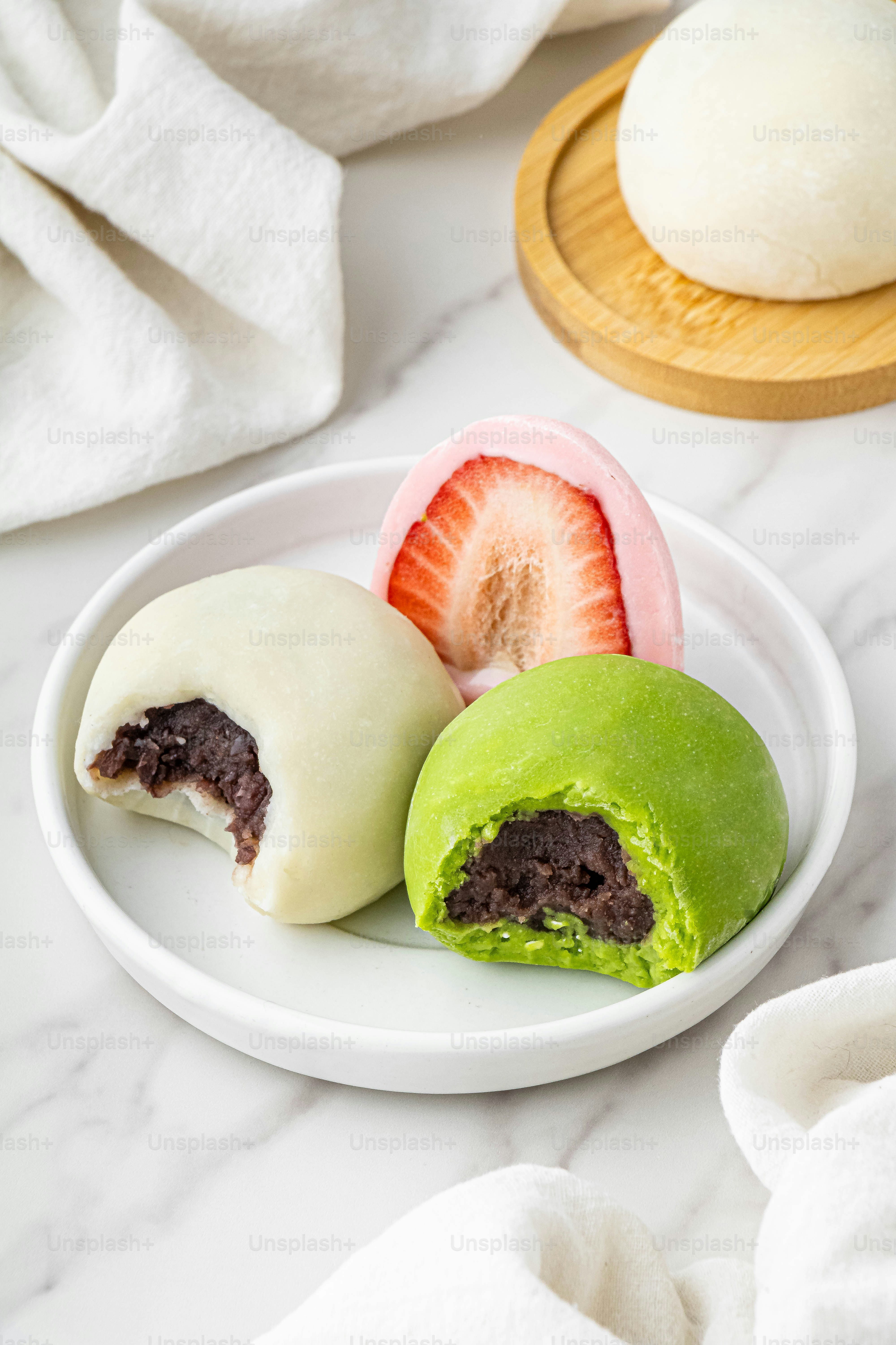 a white plate topped with fruit and pastries