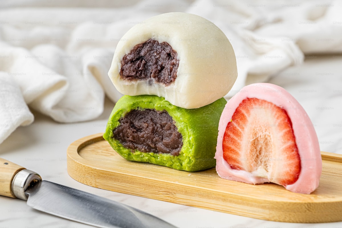 Colorful Japanese mochi rice cakes — soft, chewy daifuku filled with sweet red bean paste