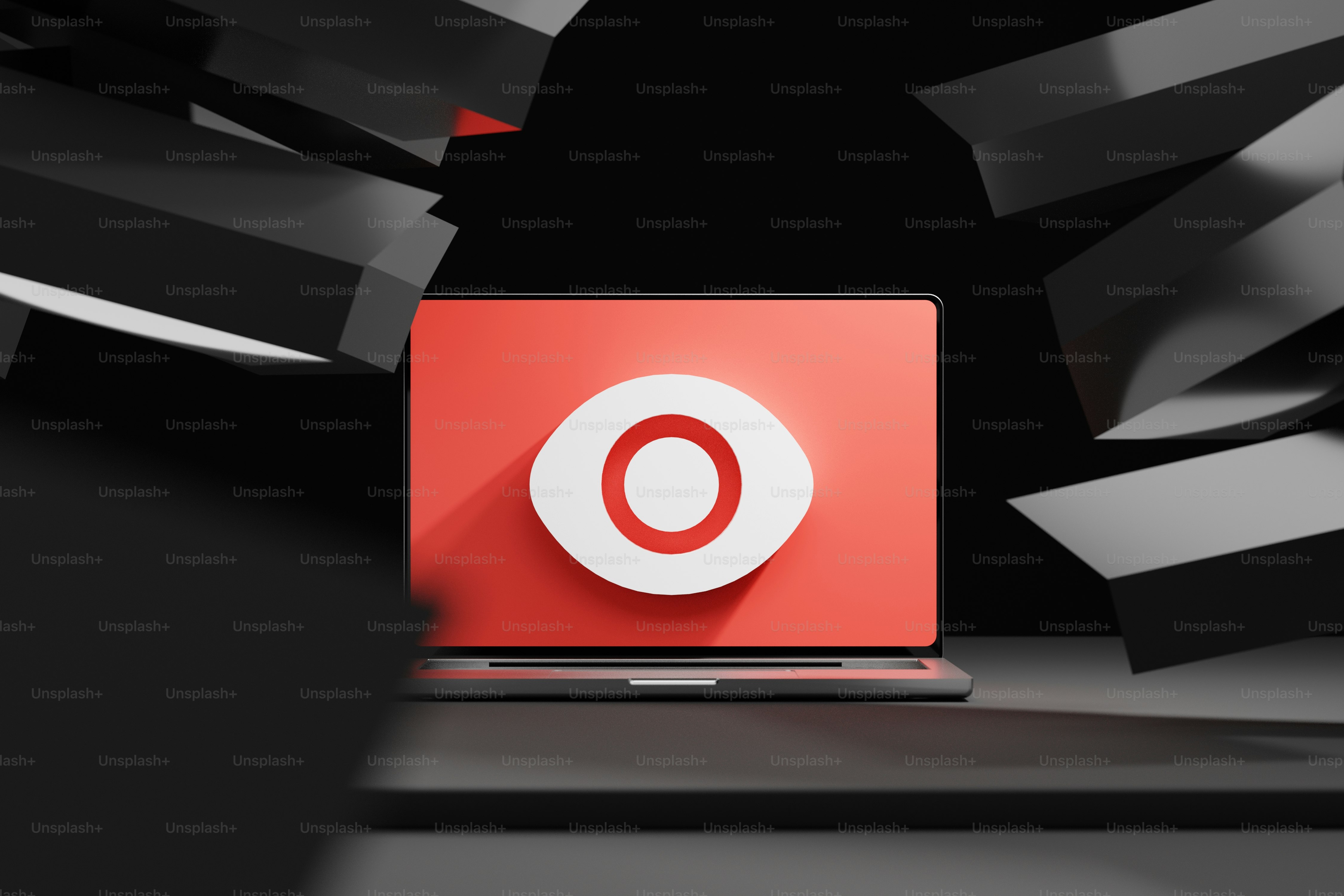 a laptop computer with a red logo on the screen