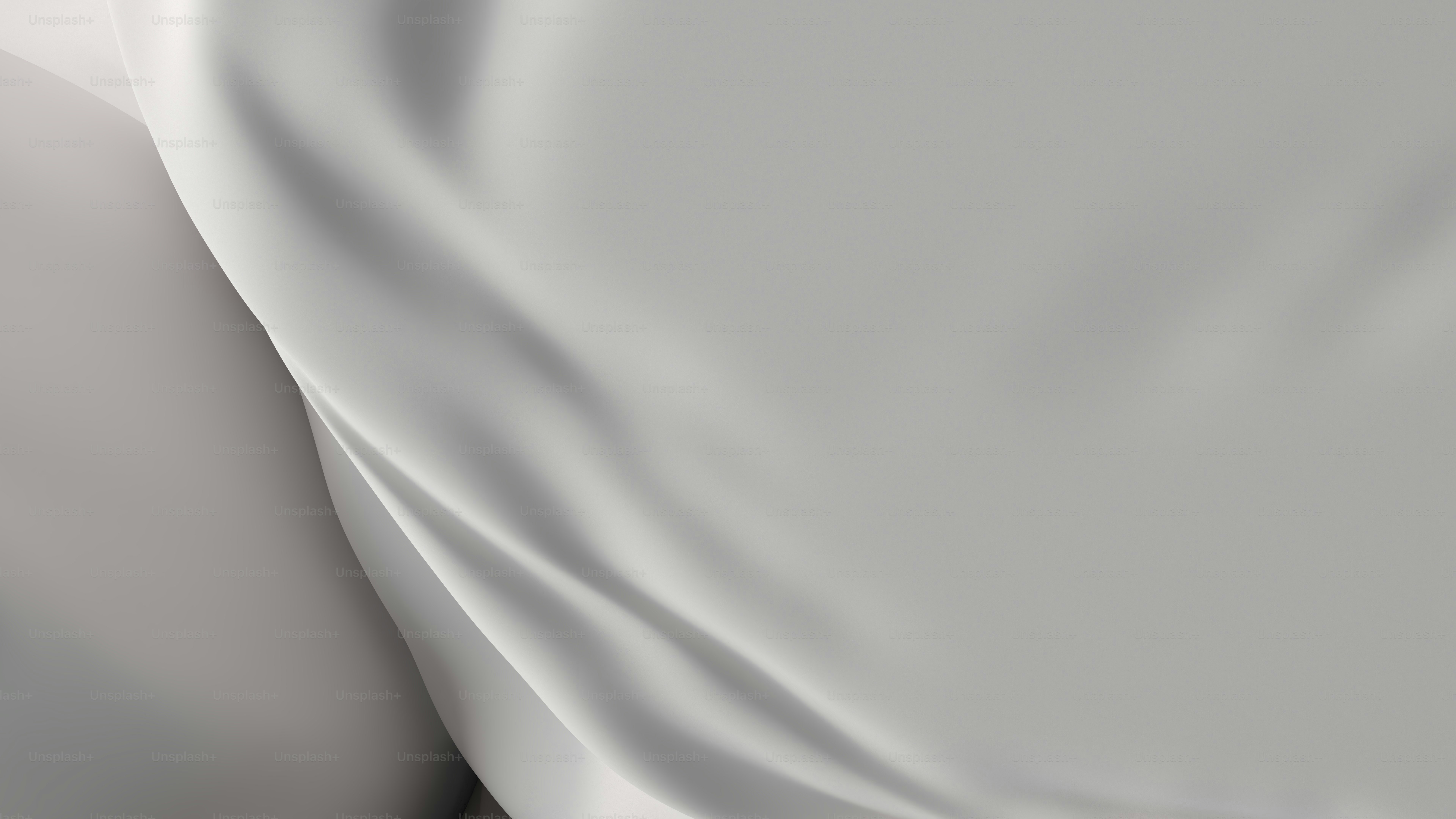 A close up of a bed with a white sheet photo Render Image on Unsplash