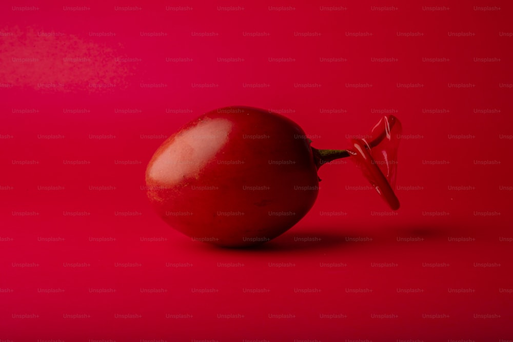 a red apple with a bow on it