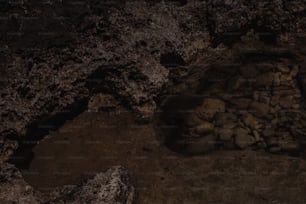 a pile of rocks sitting on top of a dirt ground