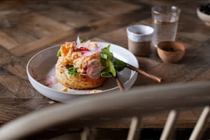 a plate of food on a wooden table