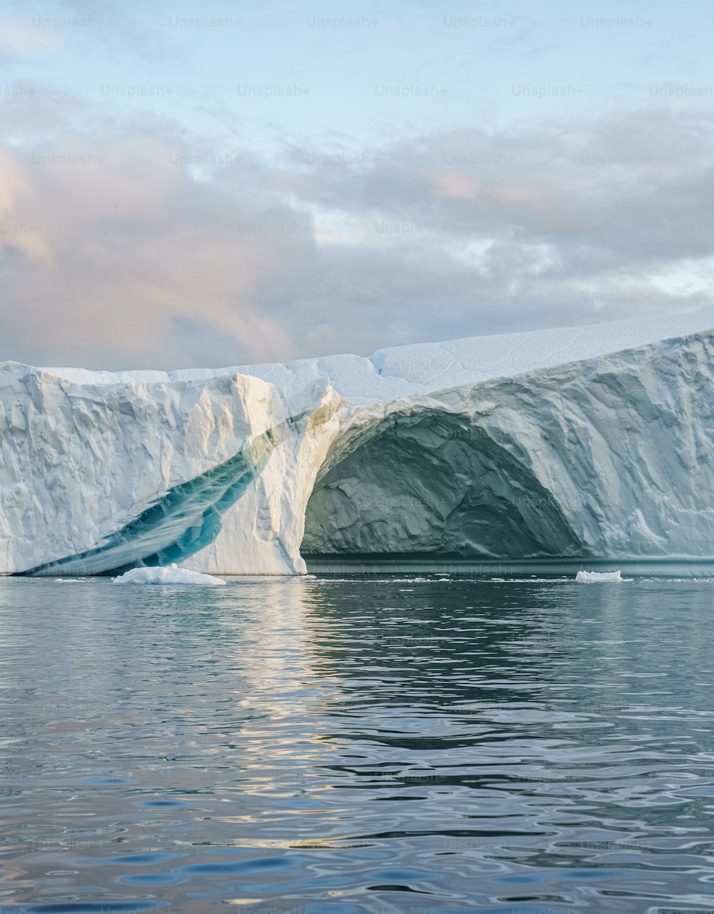 a large iceberg in the middle of a body of water