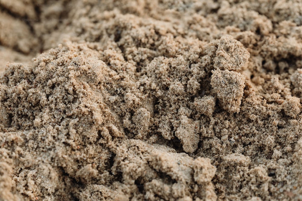 a close up of a pile of sand