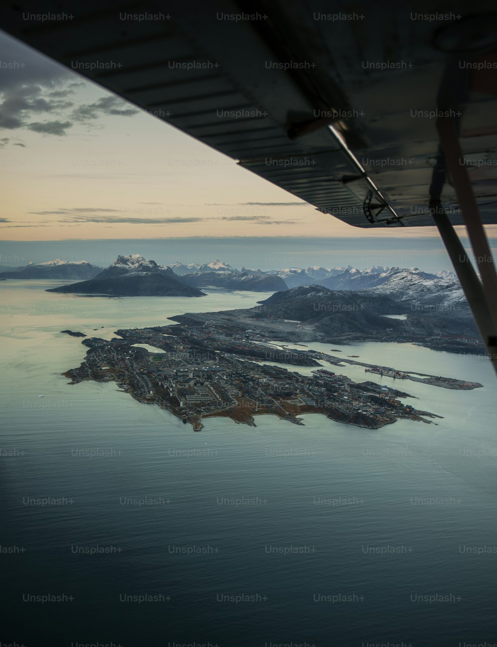 an aerial view of a city and a body of water