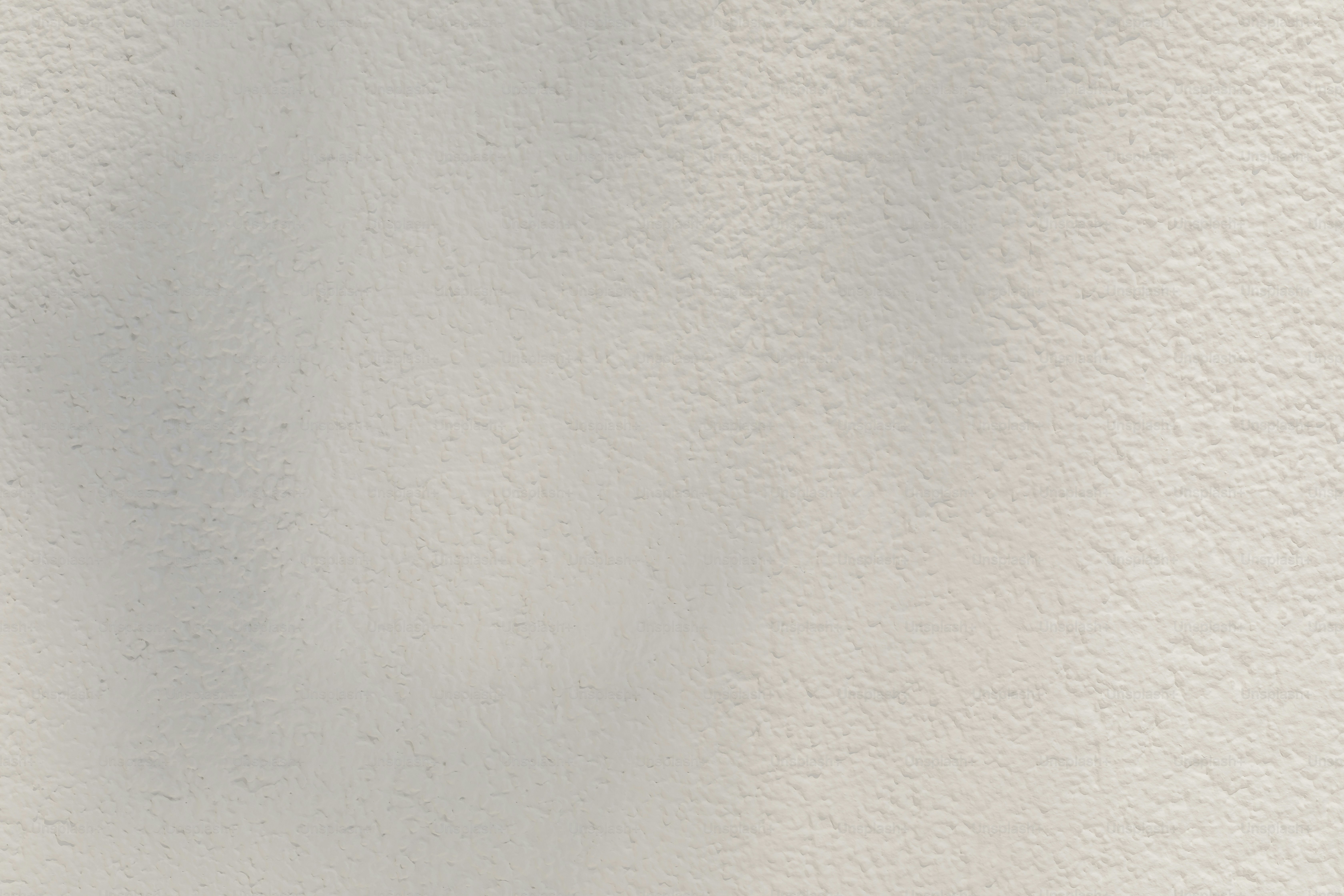 a white wall with a shadow of a person on it