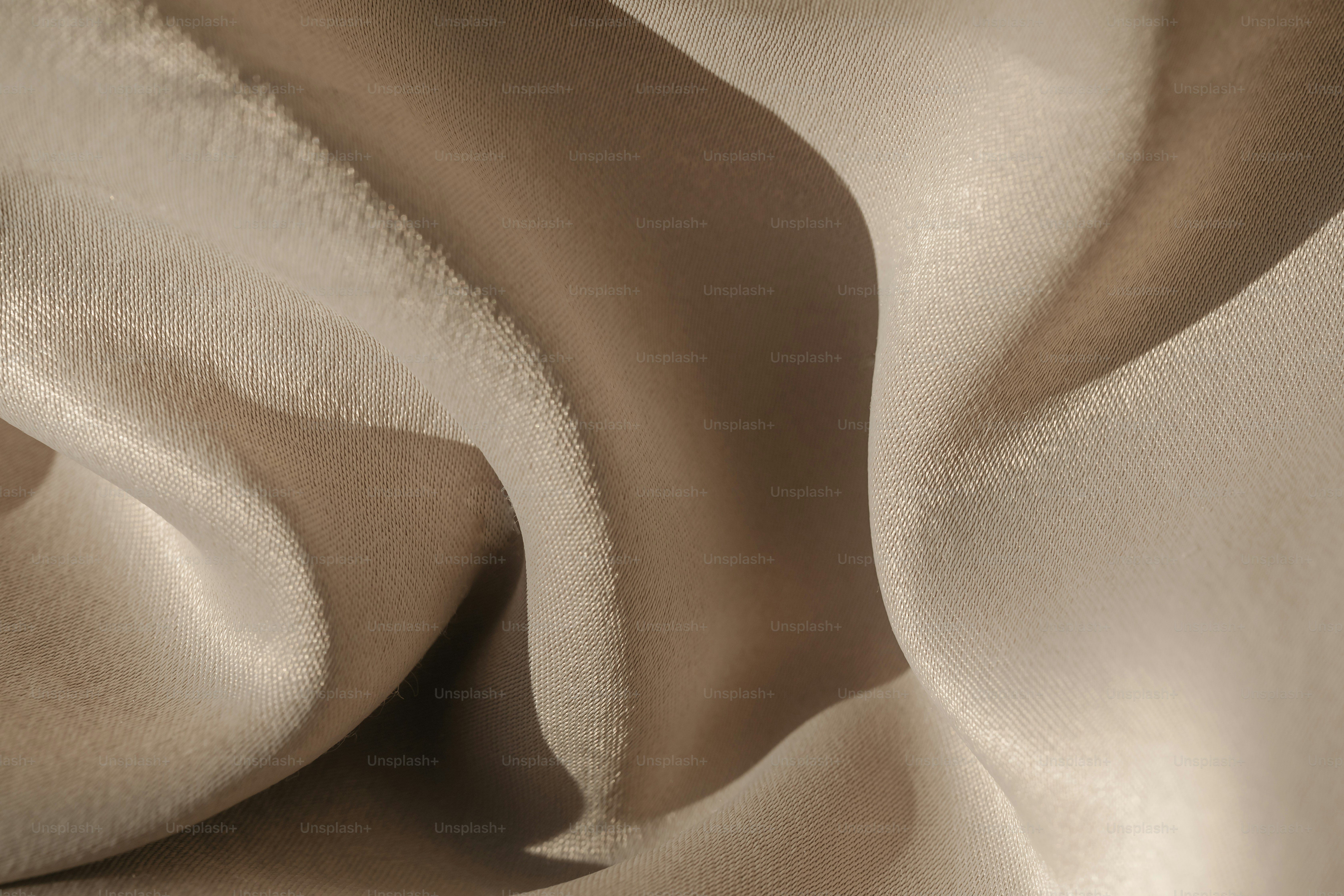 a close up of a beige fabric with a wavy pattern