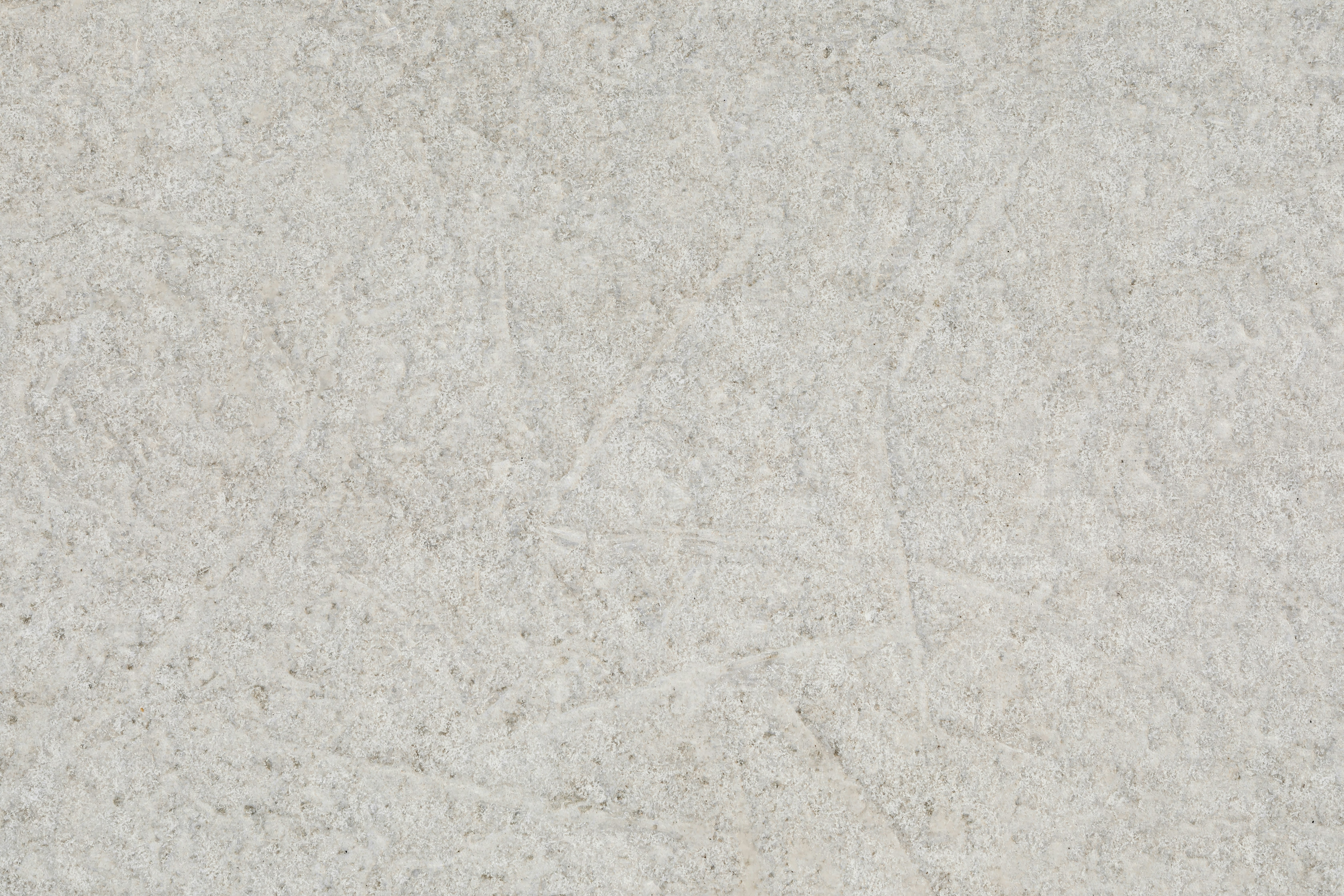a close up of a white marble surface