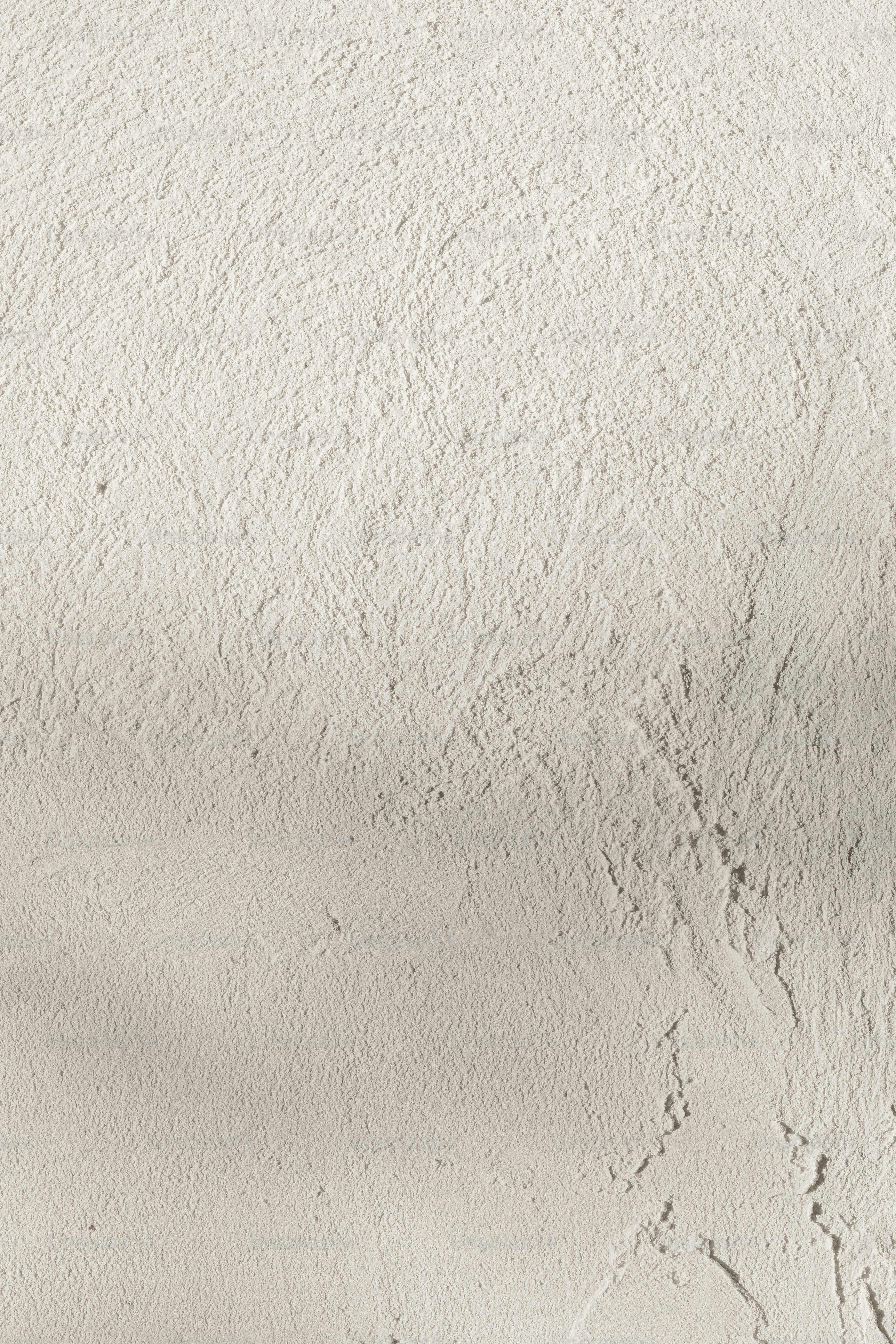 a man riding a snowboard down a snow covered slope