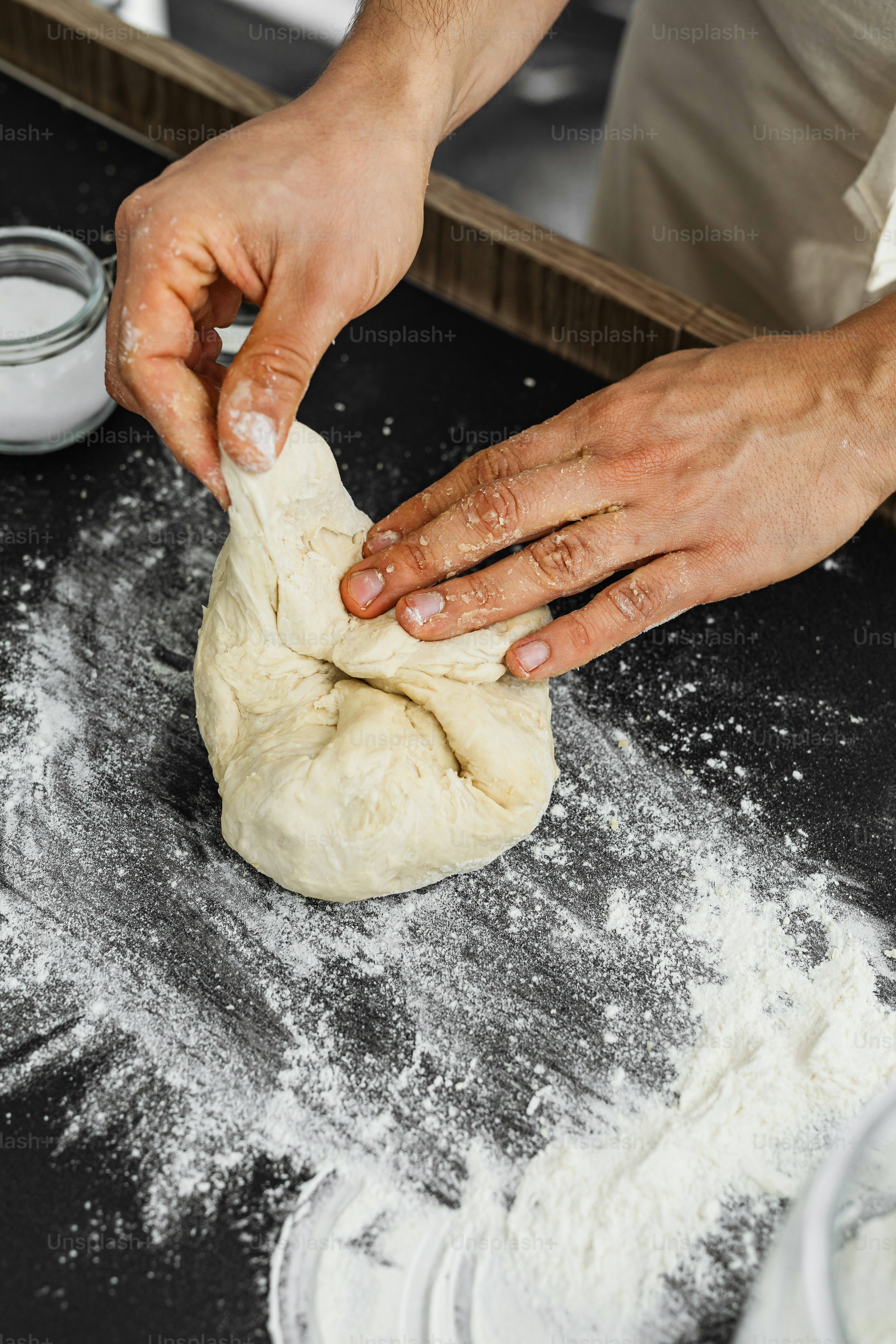 Baker shaping dough
