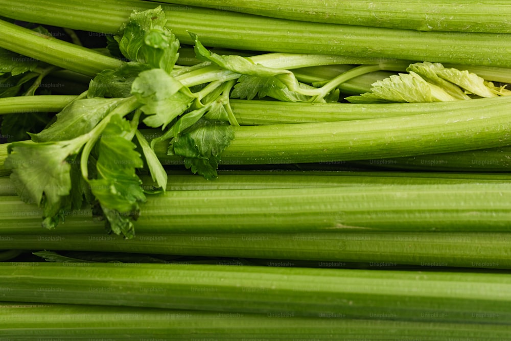 a pile of celery sitting on top of a table