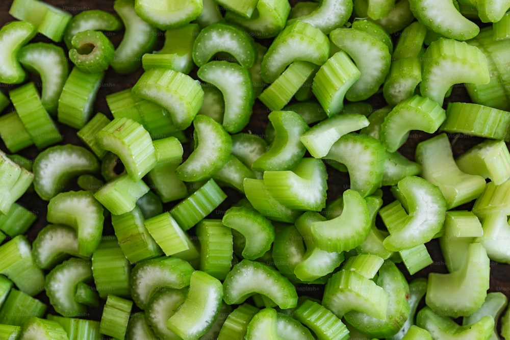 a pile of sliced up celery sitting on top of a table