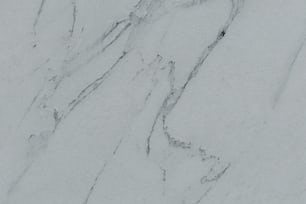 a close up of a white marble surface