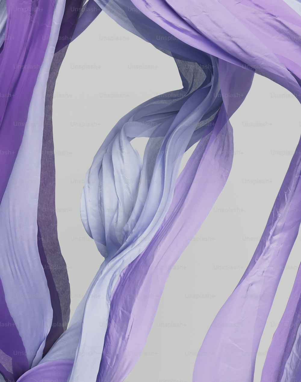 a close up of a purple and white scarf