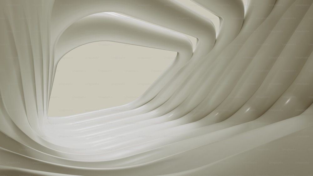 an abstract photo of a curved white wall