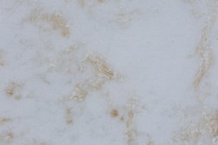 a close up of a white marble surface