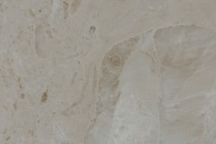 a close up of a white marble wall