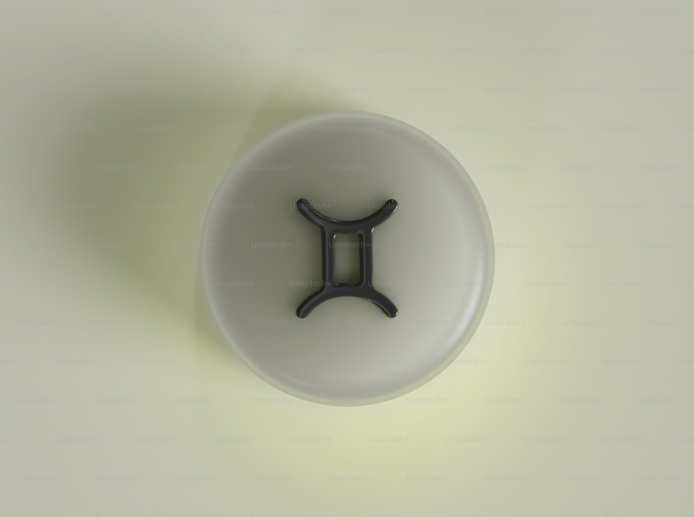 a white object with a black object in the middle of it