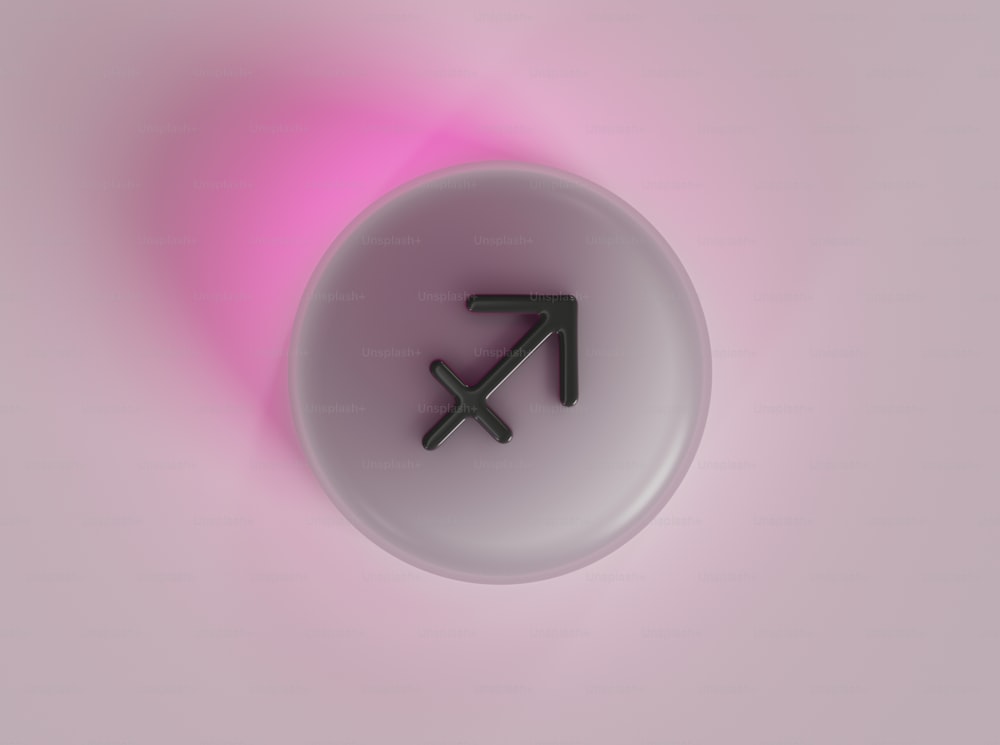 a white button with a black arrow on it