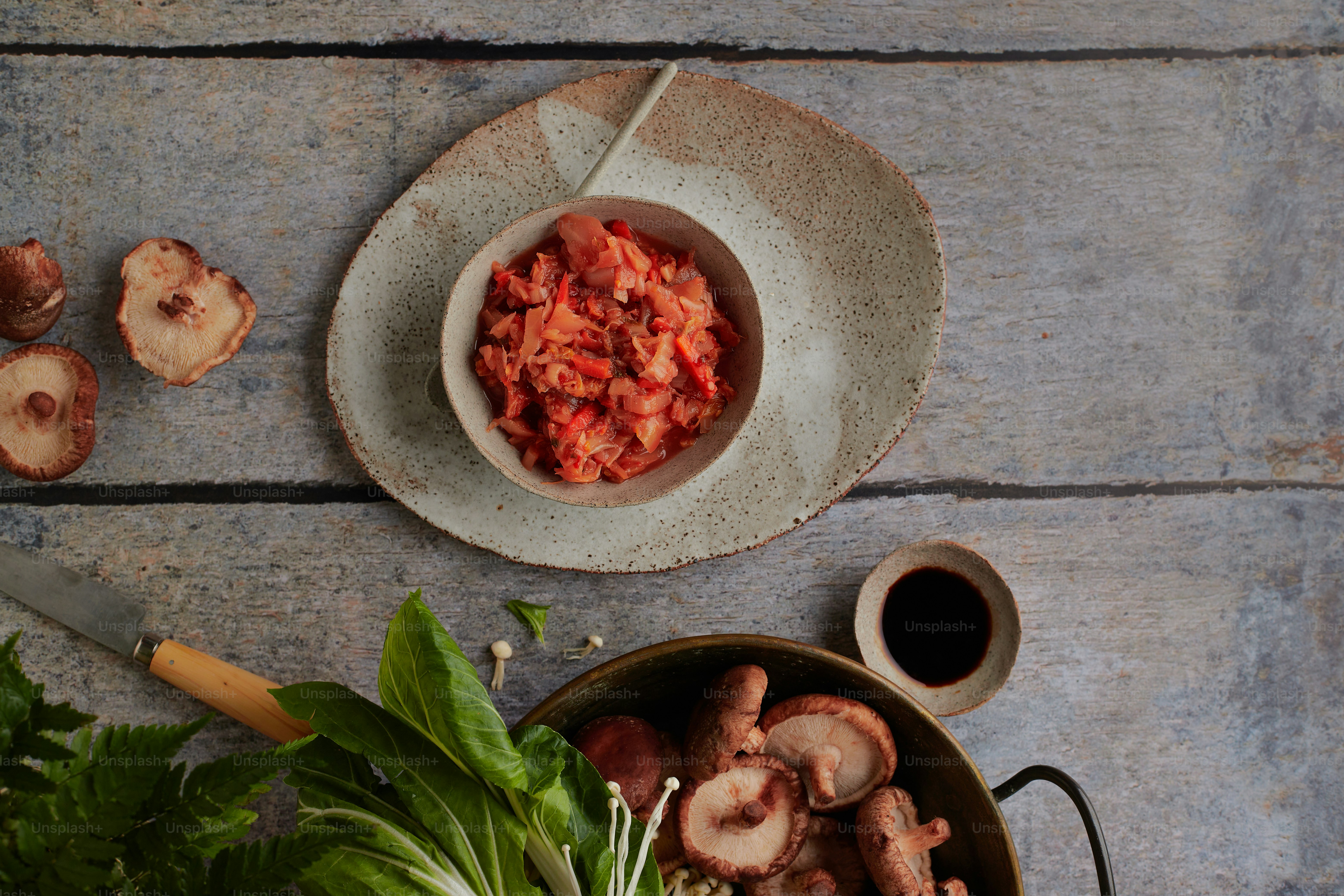 a bowl of food on a wooden table
