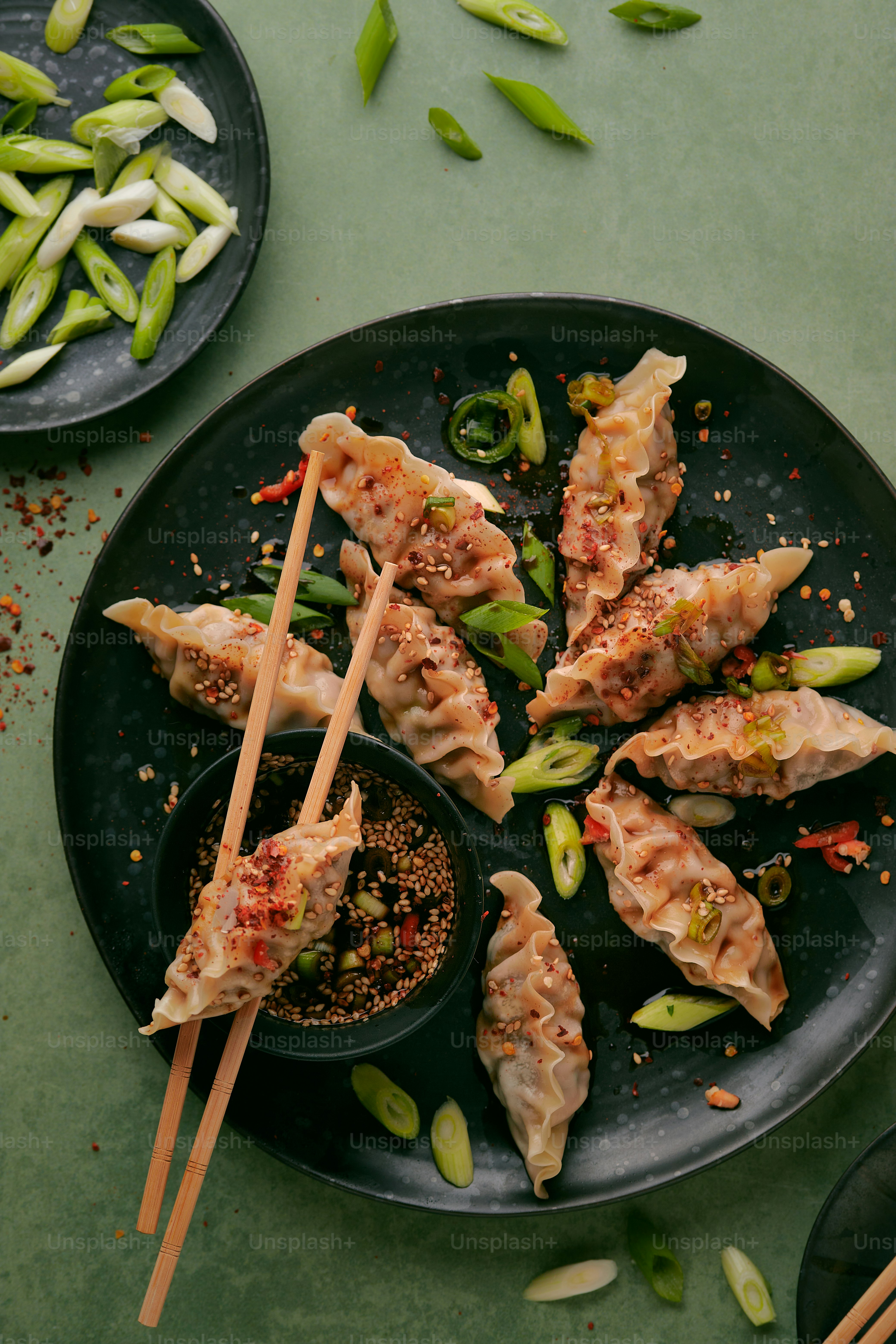 a plate of food with chopsticks on it