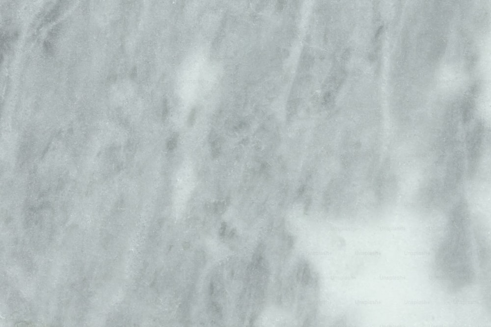 a white marble textured background that looks like marble