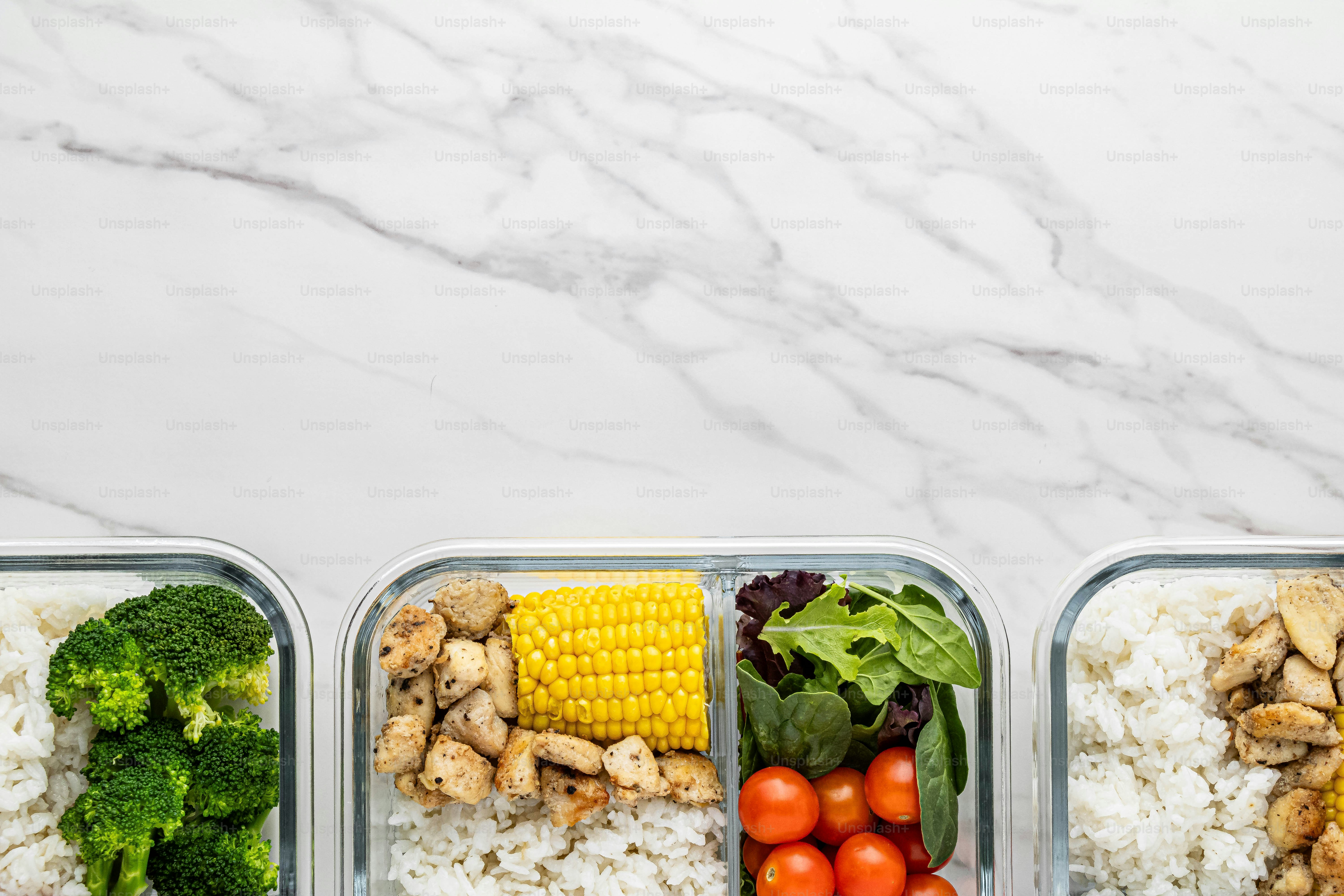 three plastic containers filled with different types of food