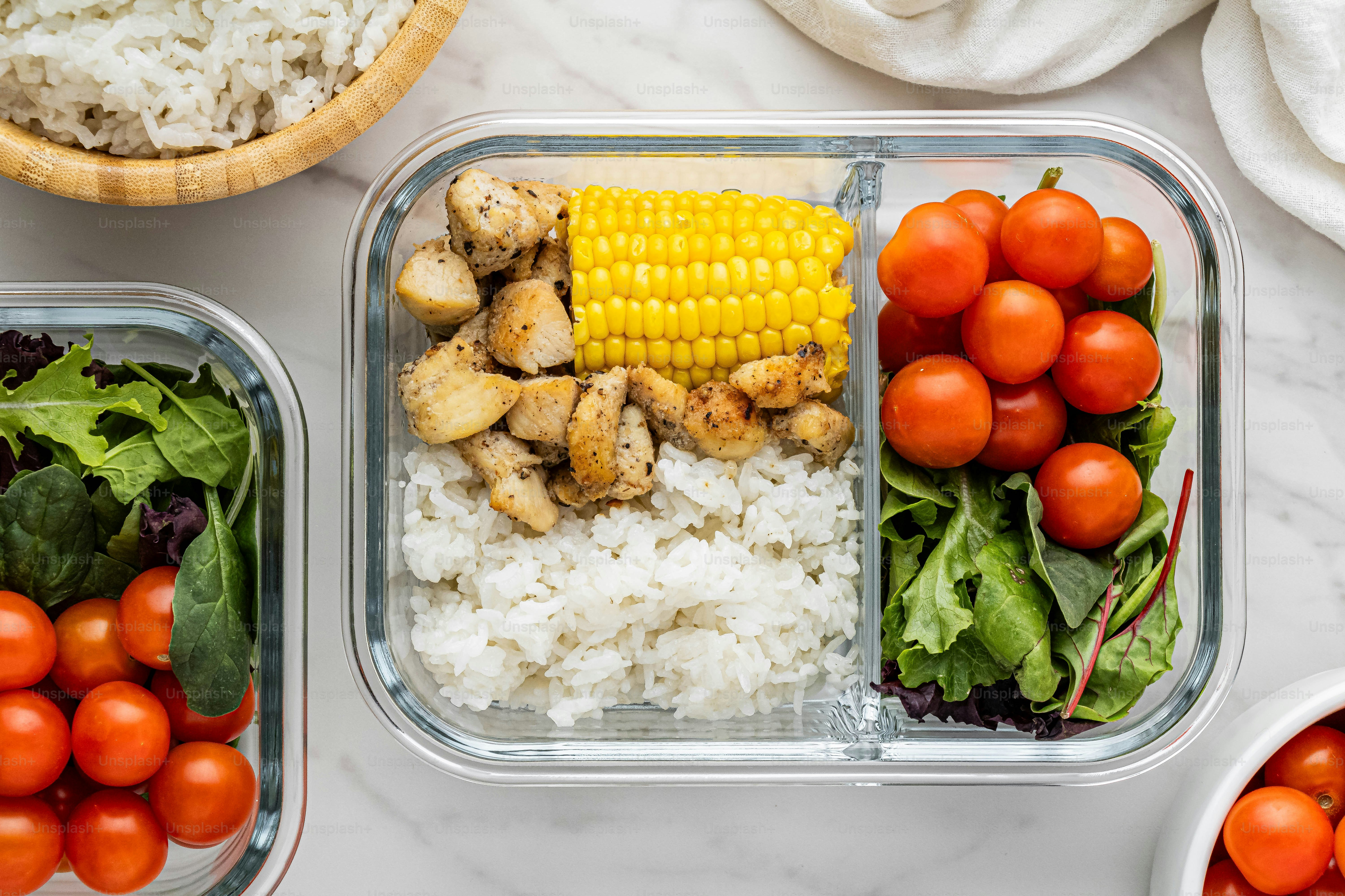 Four plastic containers filled with different types of food photo ...