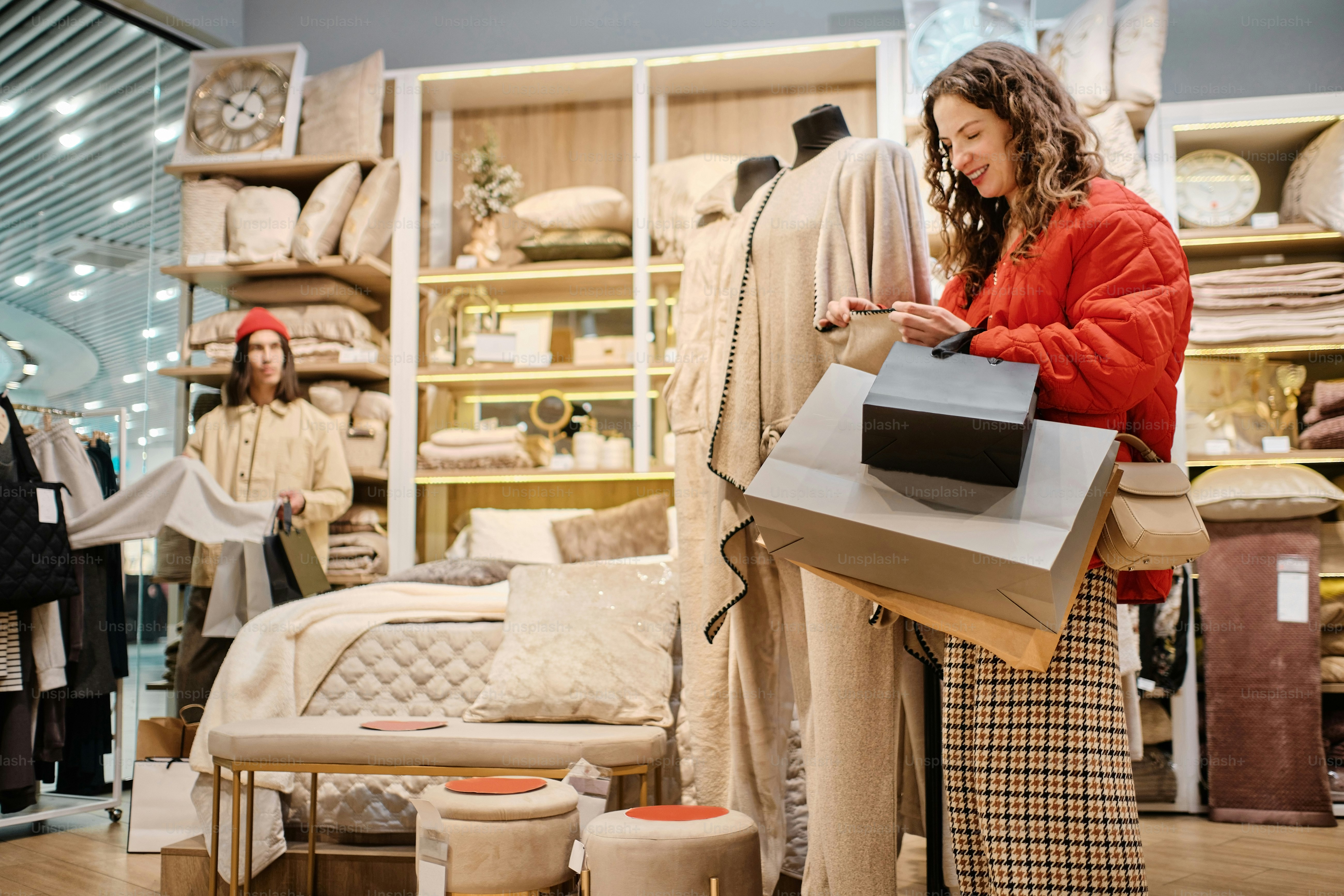 a woman looking at a bag in a store