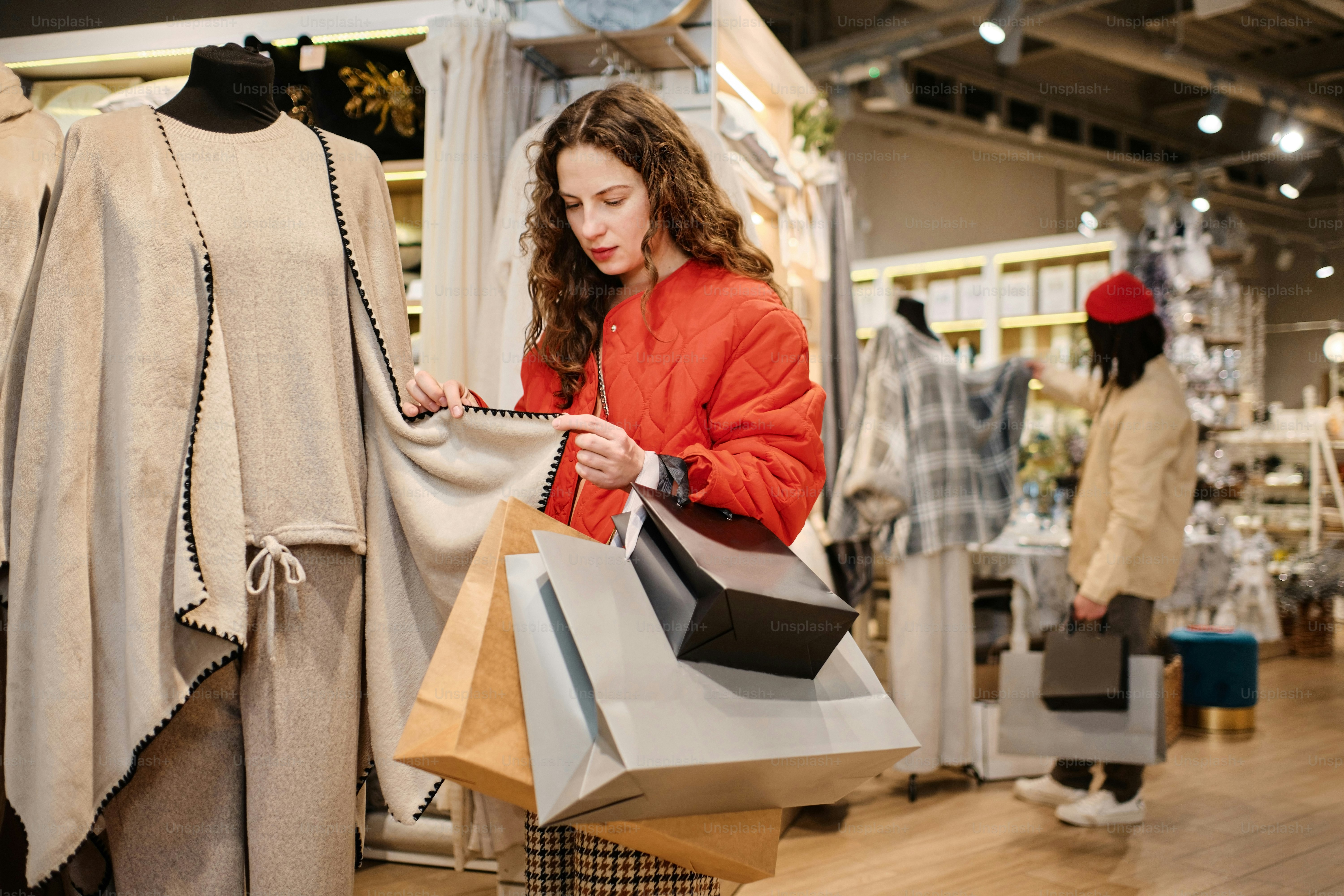 a woman looking at a bag in a store
