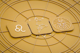 un signo del zodiaco y un símbolo del zodíaco sobre un fondo amarillo