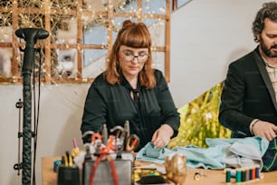 a man and a woman working on a project