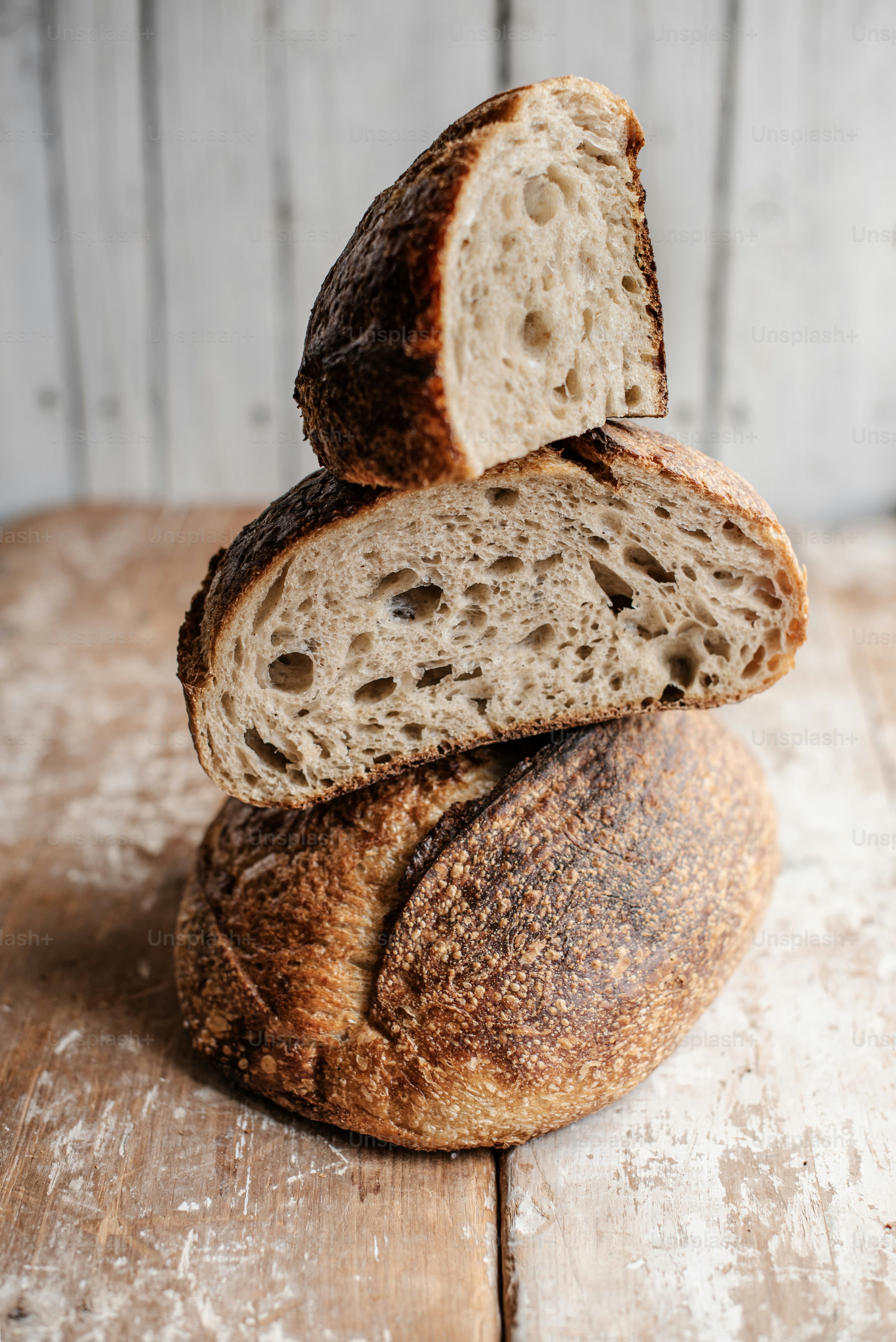 a loaf of bread sitting on top of a wooden table