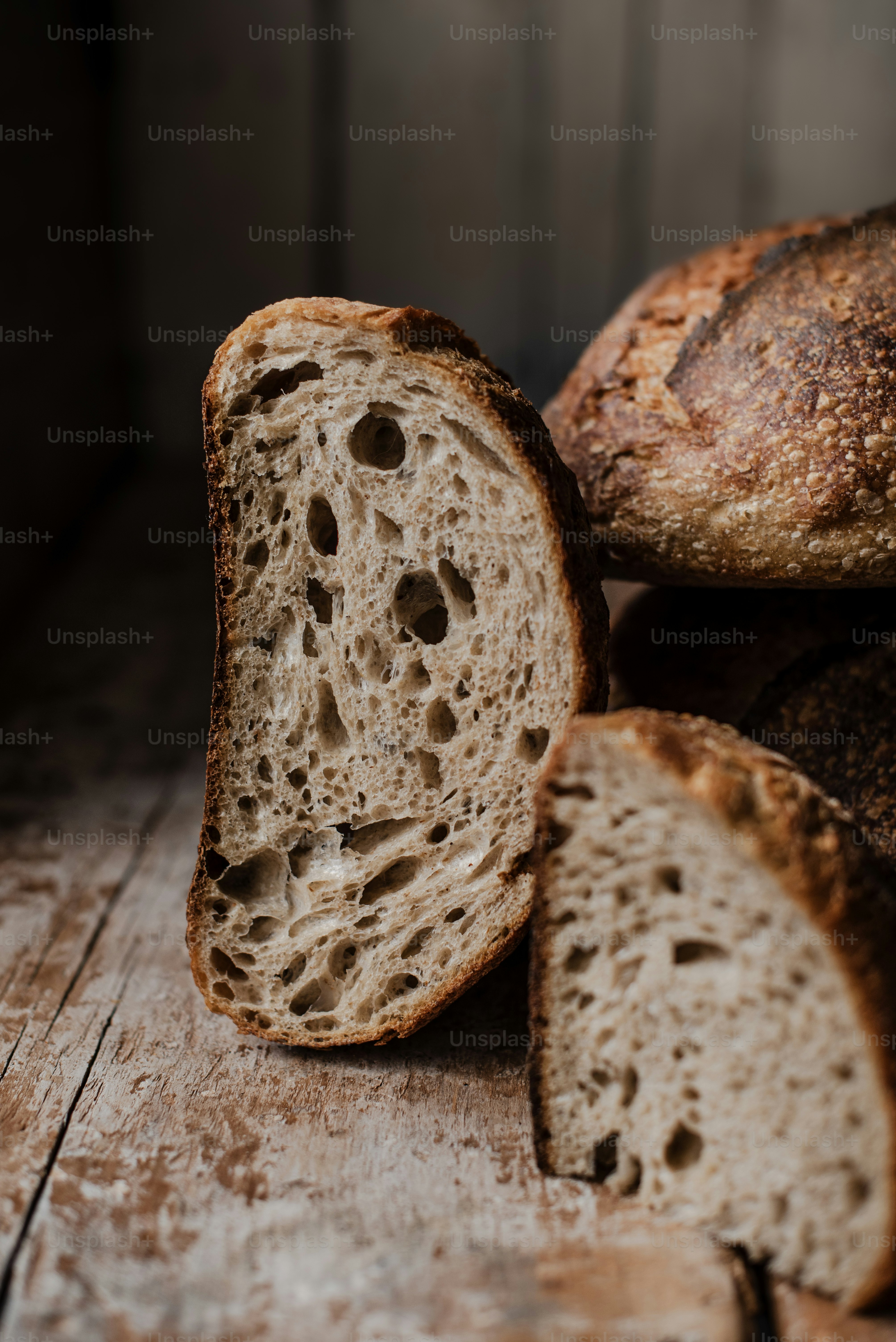 a loaf of bread sitting on top of a wooden table