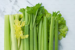 a bunch of celery sitting on top of a table