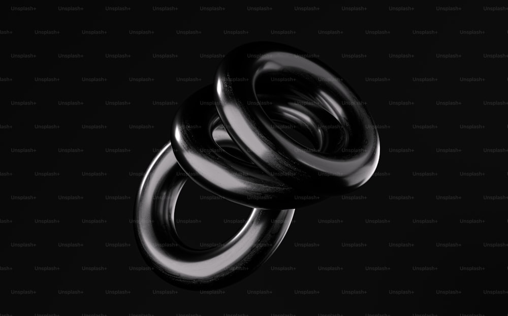 uma foto em preto e branco de dois anéis