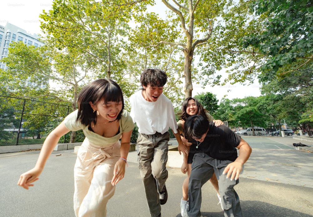a group of young people playing with a skateboard