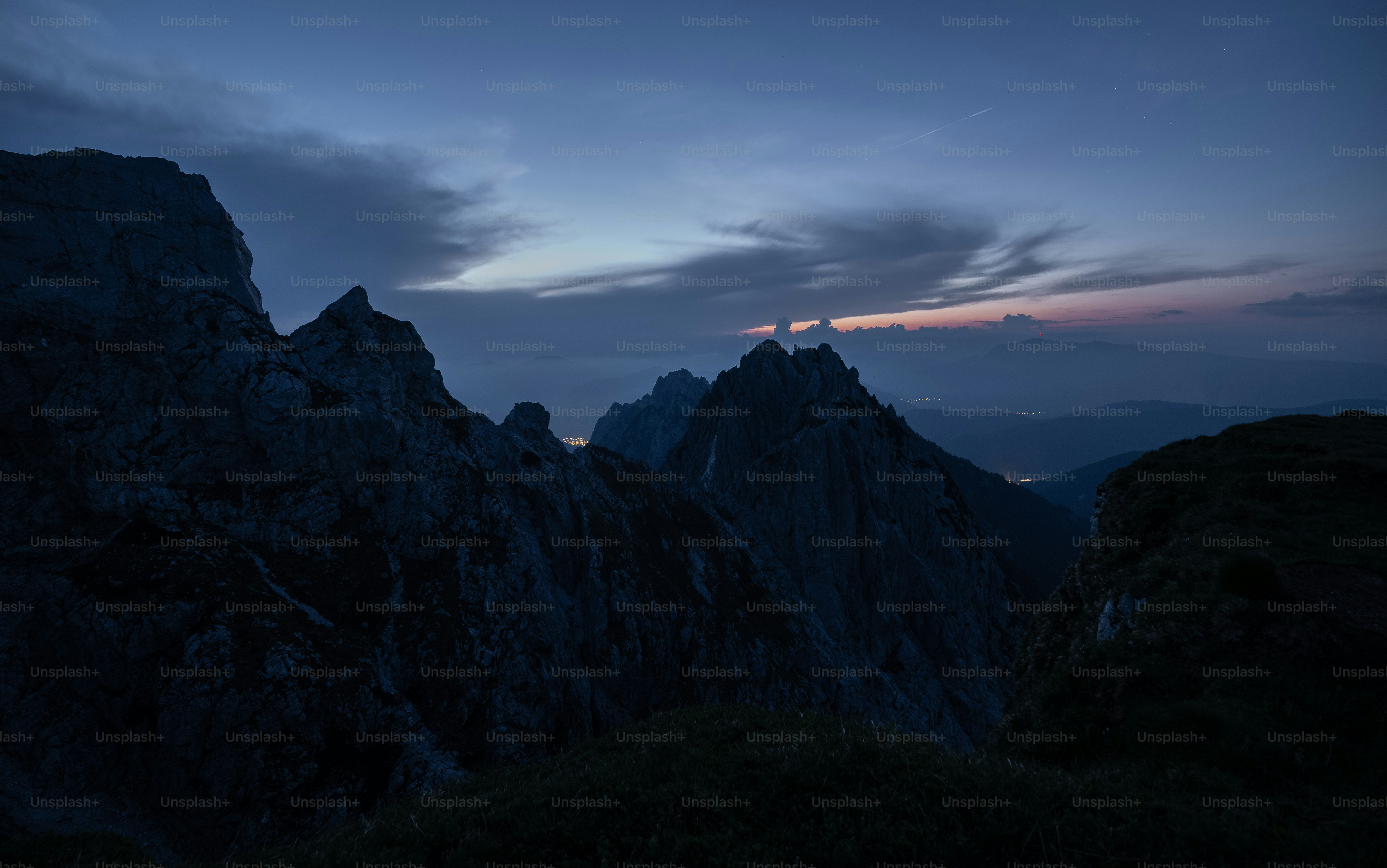 a view of a mountain range at night