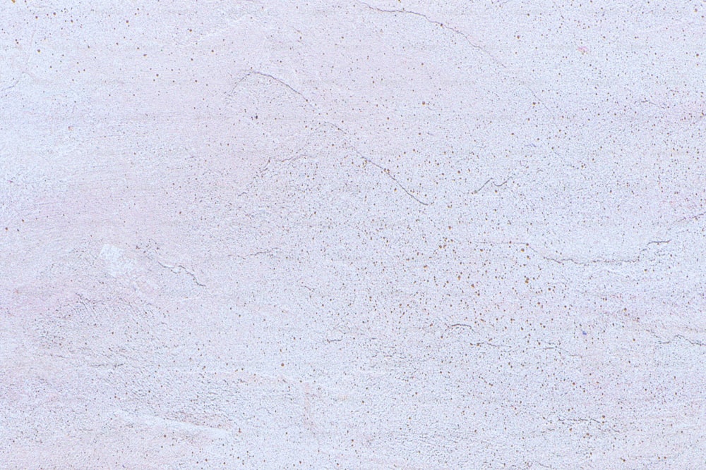 a close up of a white marble surface