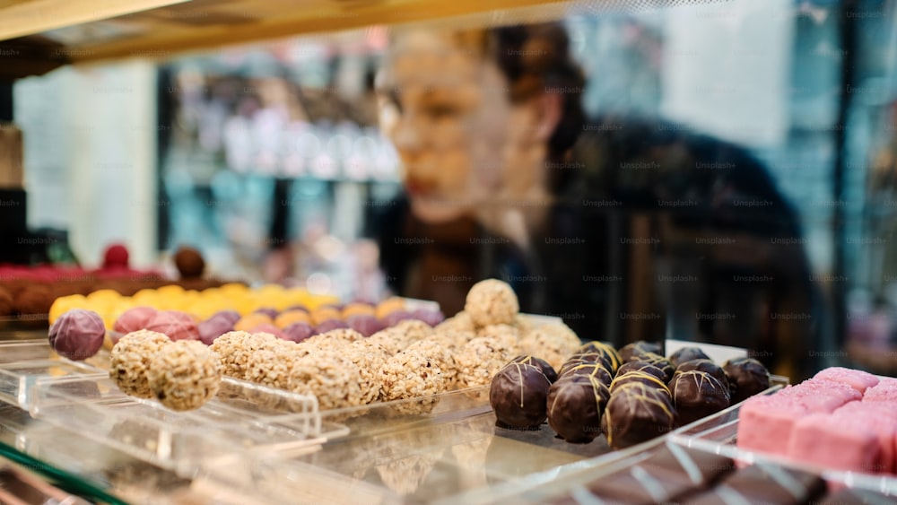 a display case filled with lots of different types of desserts