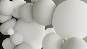 un grupo de bolas blancas flotando una encima de la otra