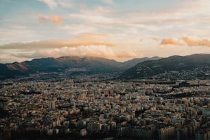 a view of a city with mountains in the background