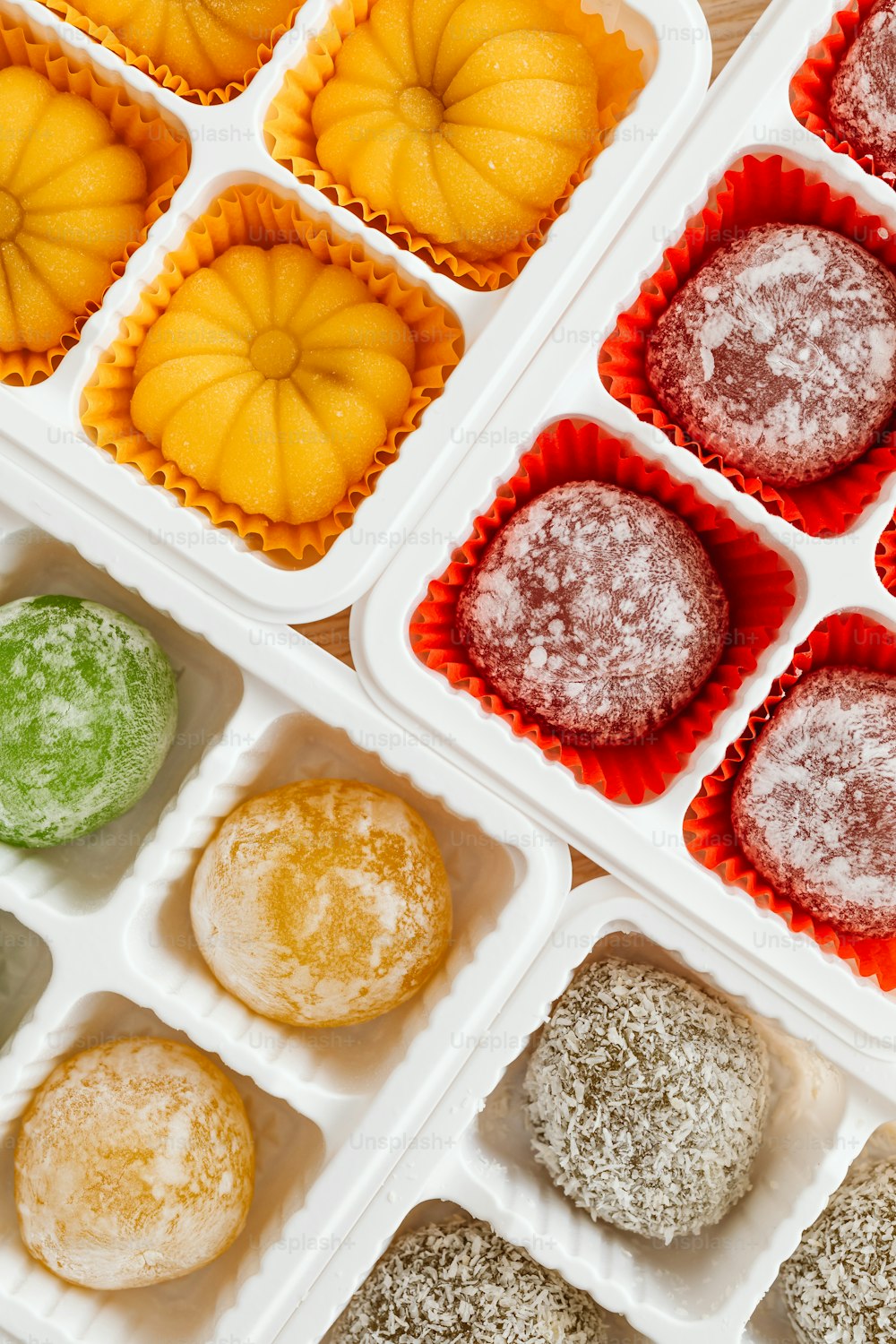 a variety of mochi in trays