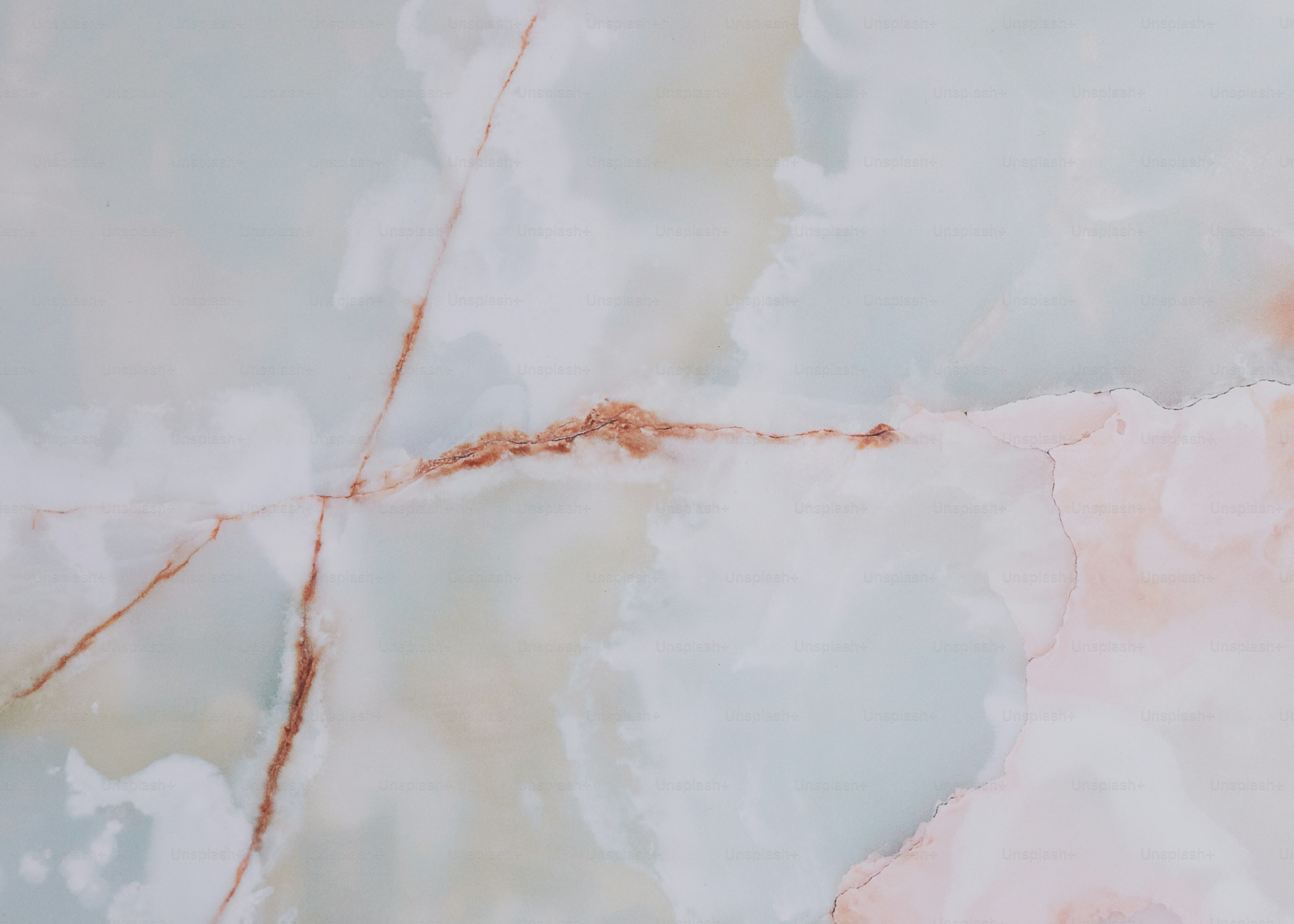 a close up of a marble surface with a red line
