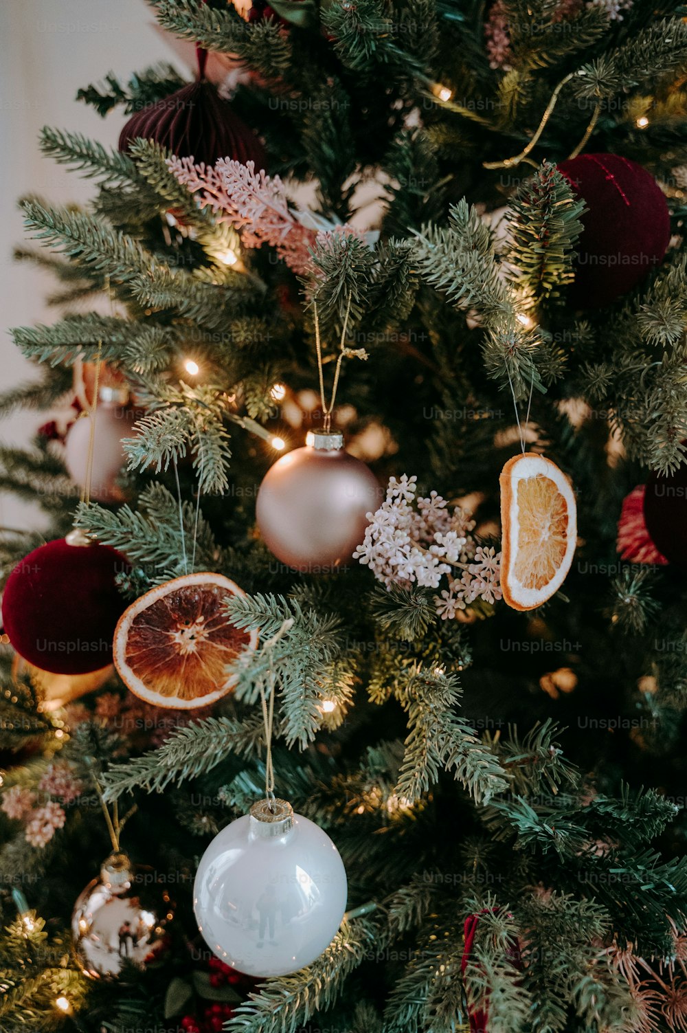 a close up of a christmas tree with ornaments