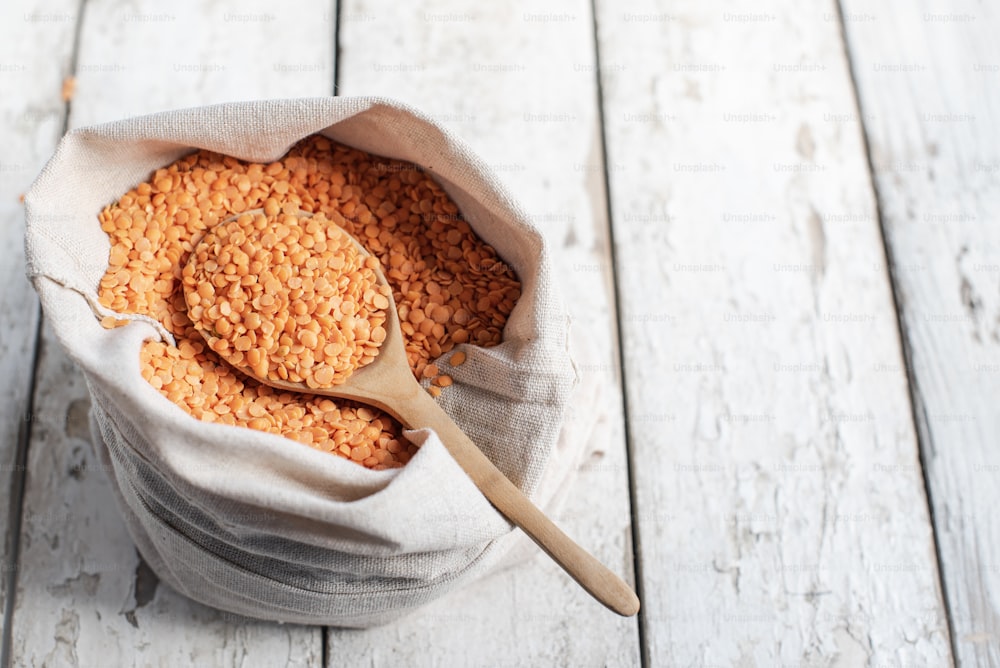 a wooden spoon is in a bag of food